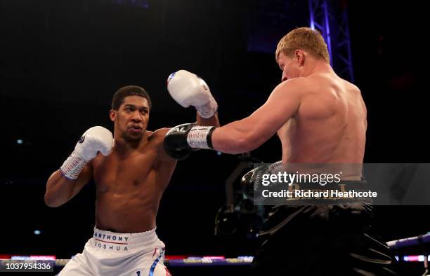 Anthony Joshua punches Alexander Povetkin during the BF, WBA Super, WBO & IBO World Heavyweight Championship title fight between Anthony Joshua and...