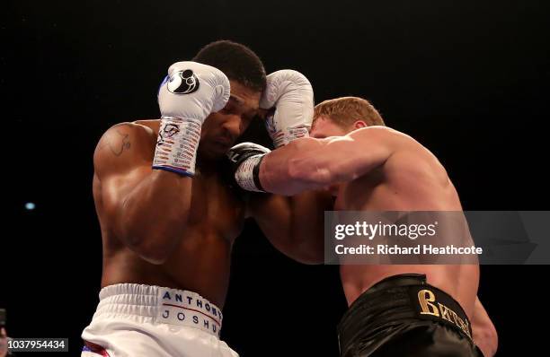 Alexander Povetkin punches Anthony Joshua during the BF, WBA Super, WBO & IBO World Heavyweight Championship title fight between Anthony Joshua and...