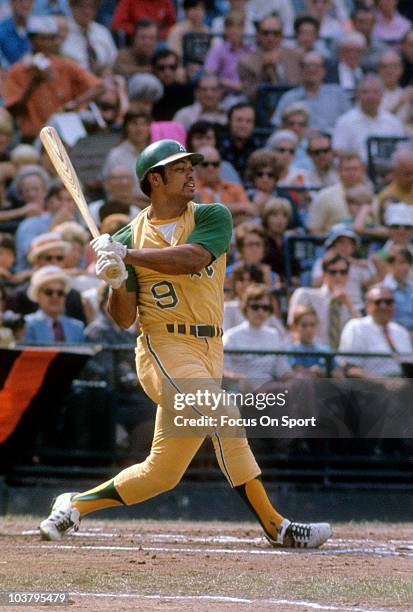 Outfielder Reggie Jackson of the Oakland Athletics swings and misses the pitch against the Baltimore Orioles during a Major League Baseball game...