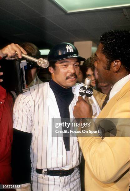 Outfielder Reggie Jackson of the New York Yankees talks with ABC Sports in the Yankees locker room after the Yankees defeated the Los Angeles Dodgers...