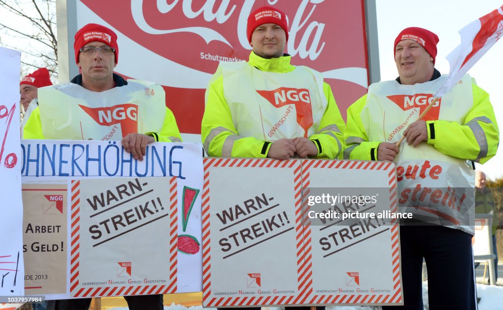 Protesting Coca Cola Employees of Coca-Cola protest with flags and signs in front of... News ...