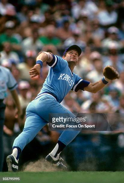 Third baseman George Brett of the Kansas City Royals tracks a fly ball against the Baltimore Orioles during a Major League baseball game circa 1982...