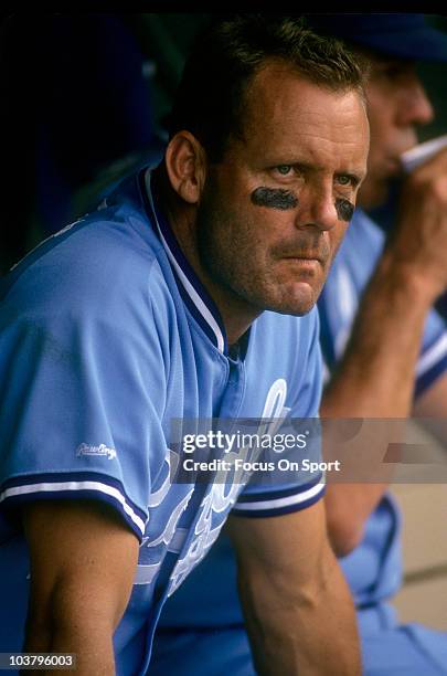 Third baseman George Brett of the Kansas City Royals looks on from the bench against the New York Yankees during a Major League baseball game circa...