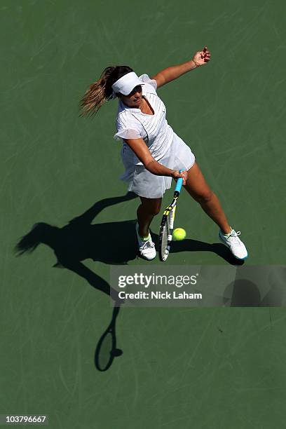 Aravane Rezai of France returns a shot to Beatrice Capra of the United States during the Women's singles on day four of the 2010 U.S. Open at the...