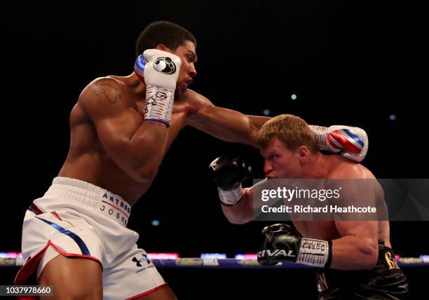 Alexander Povetkin dodges a punch from Anthony Joshua during the BF, WBA Super, WBO & IBO World Heavyweight Championship title fight between Anthony...