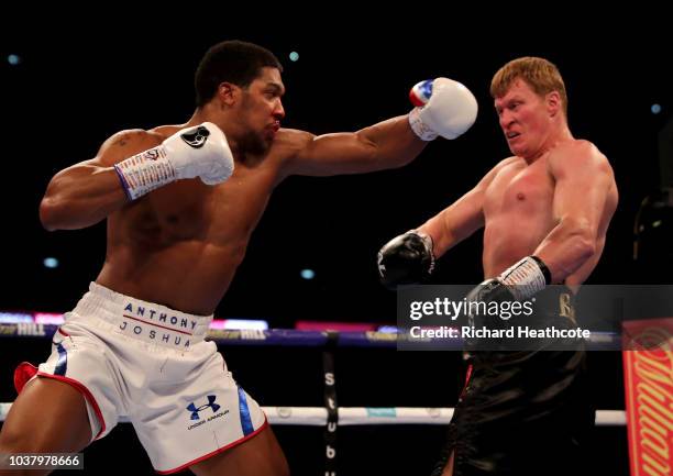 Alexander Povetkin dodges a punch from Anthony Joshua during the BF, WBA Super, WBO & IBO World Heavyweight Championship title fight between Anthony...