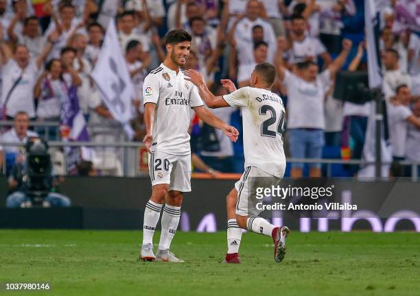 Marco Asensio and Dani Ceballos of Real Madrid celebrates after scoring his team's first goal during the La Liga match between Real Madrid CF and RCD...