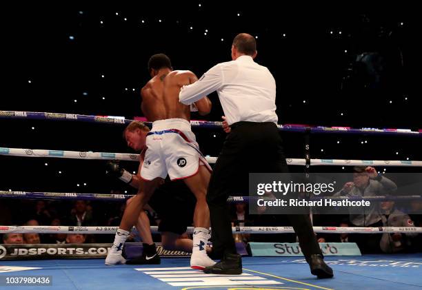 The referee stops the fight as Anthony Joshua punches Alexander Povetkin during the IBF, WBA Super, WBO & IBO World Heavyweight Championship title...