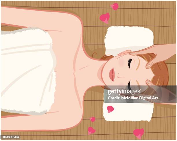 woman receiving massage at spa - forehead stock illustrations
