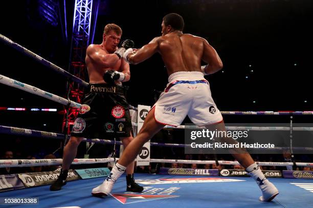 Anthony Joshua punches Alexander Povetkin during the IBF, WBA Super, WBO & IBO World Heavyweight Championship title fight between Anthony Joshua and...