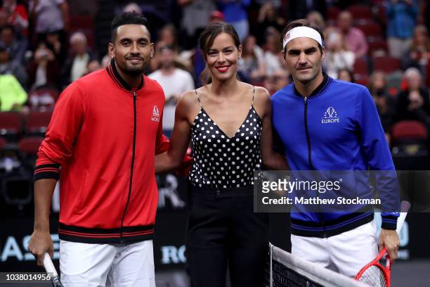 Team World Nick Kyrgios of Australia and Team Europe Roger Federer of Switzerland pose with former tennis player Ana Ivanovic of Serbia prior to...