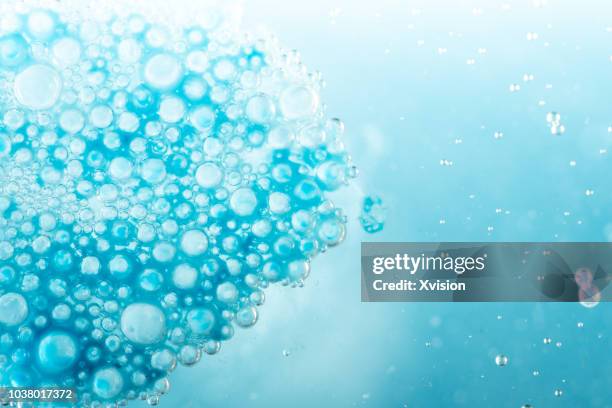 blue bubbles float on water studio shot - blender explosion stock pictures, royalty-free photos & images