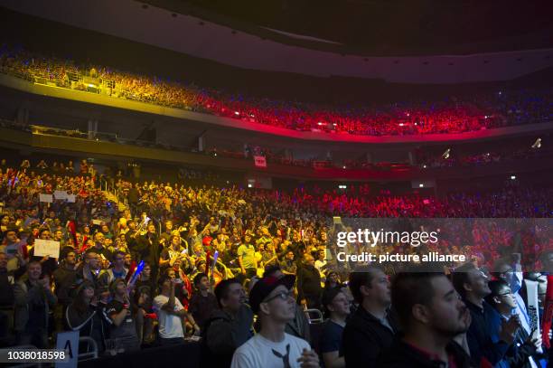 Fans sit during the world championship finale of the computer game 'League of Legends' in the Mercedes Benz Arena in Berlin, Germany, 31 October...