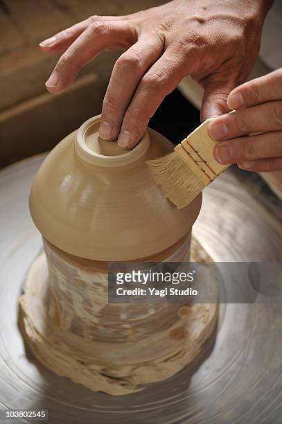 potter making bowl on pottery wheel, close-up - japanese brush stroke stock pictures, royalty-free photos & images