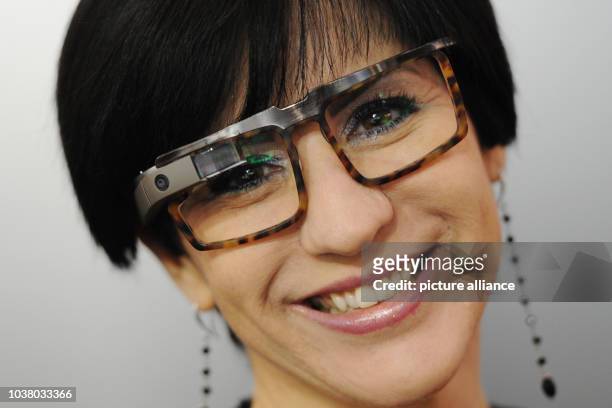 Woman wears Google Glass from the US-American company Rochester Optical at the Opti optics trade fair in Munich, Germany, 09 January 2015....
