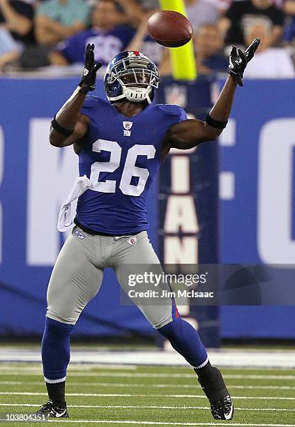 Antrel Rolle of the New York Giants intercepts a pass against the New England Patriots during the first quarter on September 2, 2010 at the New...