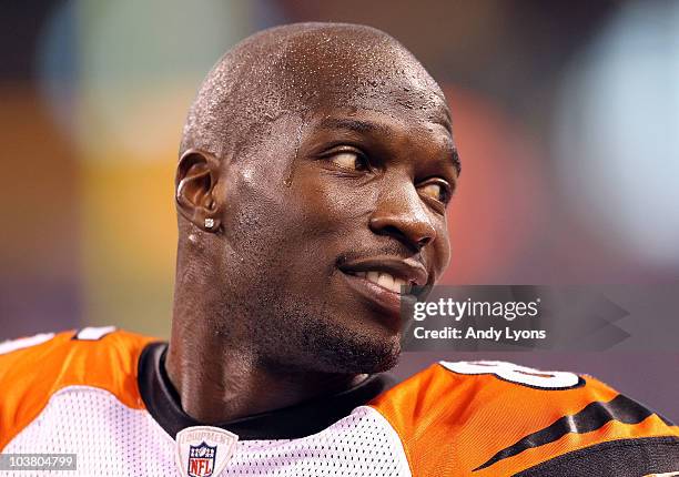 Chad Ochocinco of the Cincinnati Bengals talks with teammates during the NFL preseason game against the Indianapolis Colts at Lucas Oil Stadium on...
