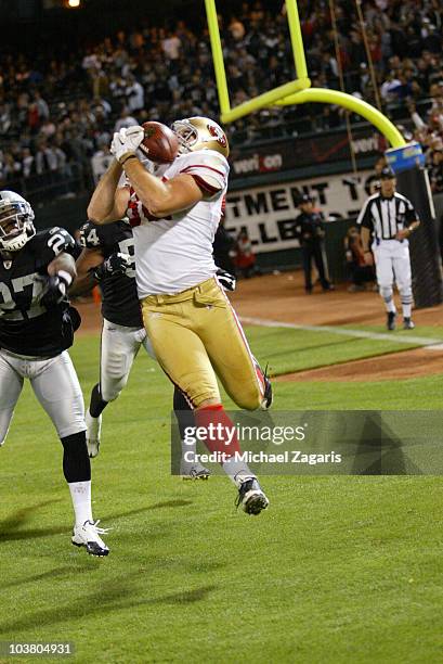 Nate Byham of the San Francisco 49ers grabbing a pass in the end zone for a two point conversion during the game against the Oakland Raiders at the...