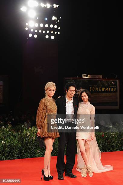 Actress Rinko Kikuchi, actor Kenichi Matsuyama and actress Kiko Mizuhara attend the "Norwegian Wood" premiere at the Palazzo del Cinema during the...