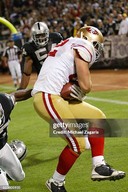 Nate Byham of the San Francisco 49ers grabbing a pass in the end zone for a two point conversion during the game against the Oakland Raiders at the...