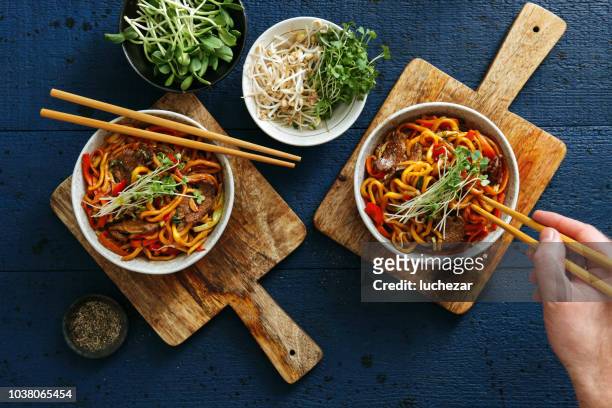 bowls with chow mein - ramen noodles stock pictures, royalty-free photos & images