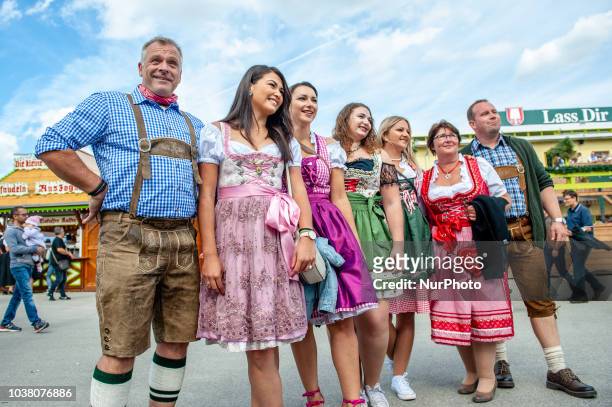 Thousands of visitors rush onto the festival area after the official entrance opening to get the best places on the first day of the 2018 Oktoberfest...