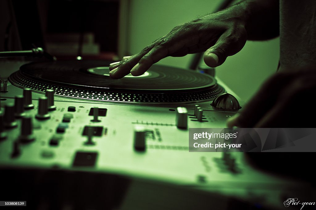 DJ mixing up music using digital turntables