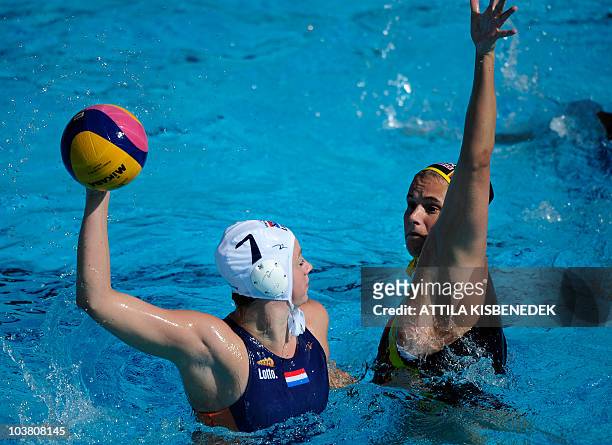 Dutch Iefke van Belkum tries to shoot against German Claudia Blomenkamp in the Mladost venue swimming pool in Zagreb on September 2, 2010 during...