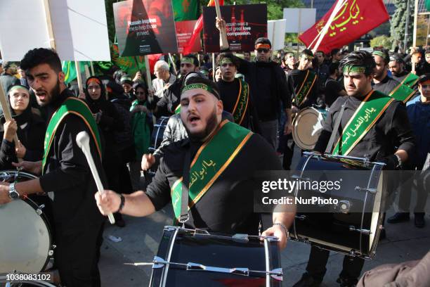 Drummers lead the procession as Iranian Shiite Muslim mourners take part in a Muharram procession in Toronto, Ontario, Canada, on October 12, 2016....