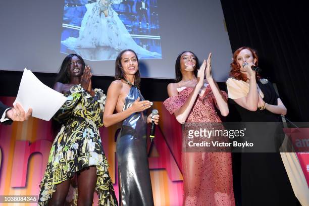 Duckie Thot, Alanna Harrington, Winnie Harlow and Karen Elson perform on stage at amfAR Gala dinner at La Permanente on September 22, 2018 in Milan,...