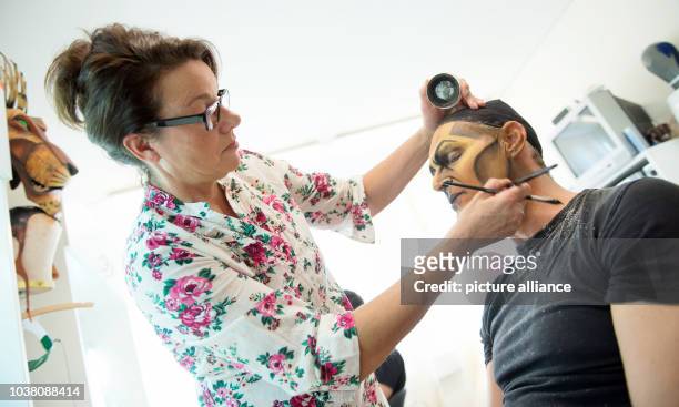 Actor Bernd Lambrecht is made up as Scar from the Lion King musical, by chief make-up artist Susanne Berghoff-Huehnerfuss in Hamburg, Germany, 5...