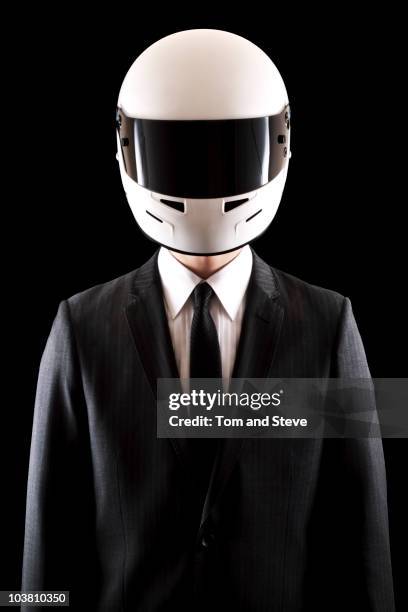 racing driver businessman in pinstripe suit straig - crash helmet stock pictures, royalty-free photos & images