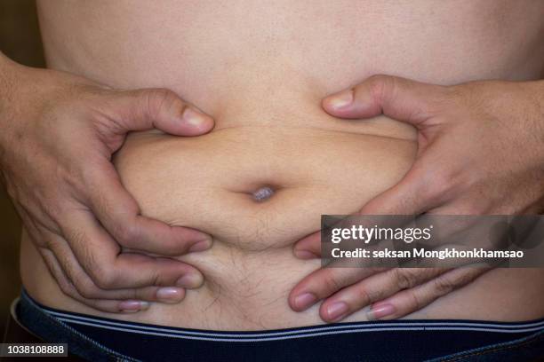 belly fat. overweight. diet. - fat loss training stockfoto's en -beelden