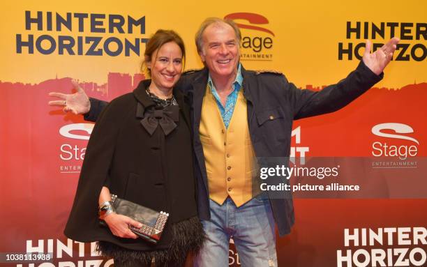 Actor Wolfgang Fierek and his wife Djamila Mendil posing on the red carpet during the premiere of the Udo Lindenberg musical 'Hinterm Horizont' in...