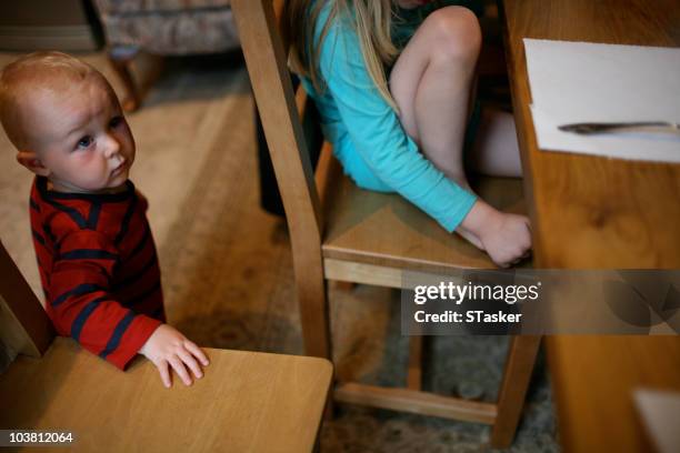 boy at table - newfamily stock pictures, royalty-free photos & images