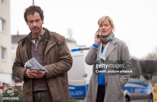 Actors Joerg Hartmann as inspector Peter Farber and actress Anna Schudt as inspector Martina Boenisch pictured during the filming of the episode...