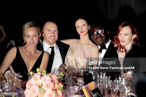 Amber Valletta, Mariacarla Boscono, Edward Enninful and Karen Elson attend amfAR Gala dinner at La Permanente on September 22, 2018 in Milan, Italy.