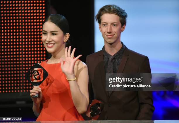 Actors Max Hauff and Aisawanya Areyawattana stand on stage during the Grimme Prize award ceremony in Marl, Germany, 8 April 2016. Both were awarded...