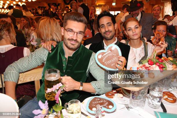 Justus Frederic Hansen, Sami Slimani and Luisa Hartema during the 'Fruehstueck bei Tiffany' at Schuetzenfestzelt at the Oktoberfest on September 22,...