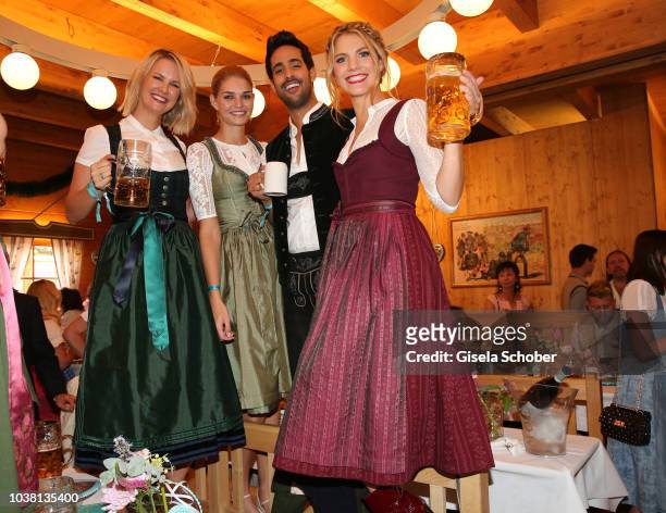 Monica Ivancan, Luisa Hartema, Sami Slimani and Viviane Geppert during the 'Fruehstueck bei Tiffany' at Schuetzenfestzelt at the Oktoberfest on...