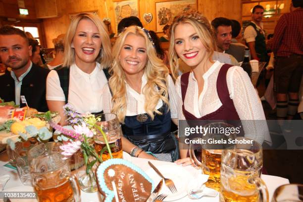 Monica Ivancan, Jennifer Knaeble and Viviane Geppert during the 'Fruehstueck bei Tiffany' at Schuetzenfestzelt at the Oktoberfest on September 22,...