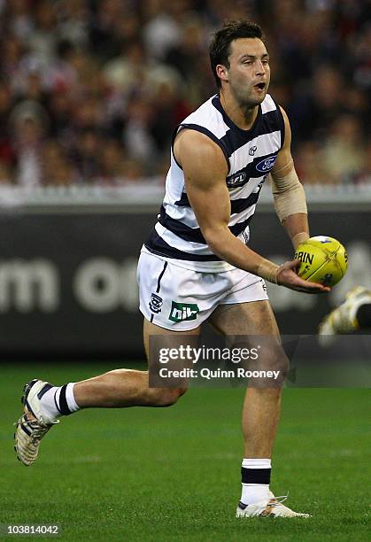 Jimmy Bartel of the Cats handballs during the AFL Second Qualifying Final match between the Geelong Cats and the St Kilda Saints at Melbourne Cricket...