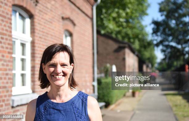 Actress Karin Kettling stands in front of her flat in the workers' settlement in Eisenheim in Oberhausen, germany, 19 August 2016. Photo: Caroline...