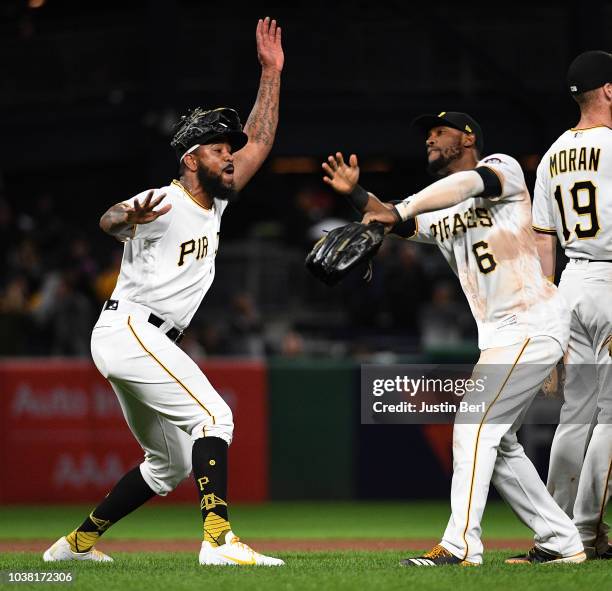 Felipe Vazquez of the Pittsburgh Pirates celebrates with Starling Marte after the final out in a 3-0 win over the Milwaukee Brewers at PNC Park on...