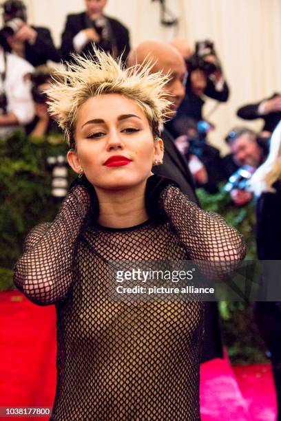 Actress Miley Cyrus arrives at the Costume Institute Gala for the "Punk: Chaos to Couture" exhibition at the Metropolitan Museum of Art in New York...