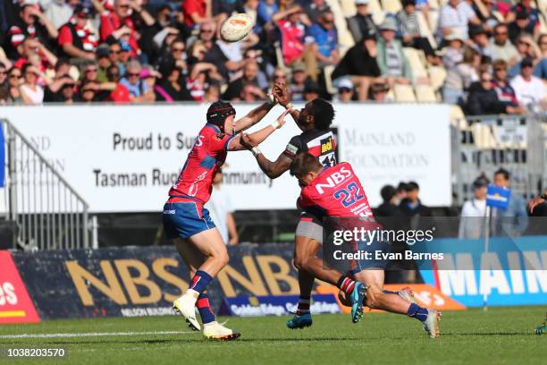 Tevita Nabura is put under pressure by Will Jordan and Alex Nankivell during the round six Mitre 10 Cup match between Tasman and Counties Manakau on...