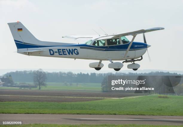 Aerial observer Michael Muenchow looks at the scenery in a Cessna 172 during a training session of the Middle Franconian Aerial Observation for the...