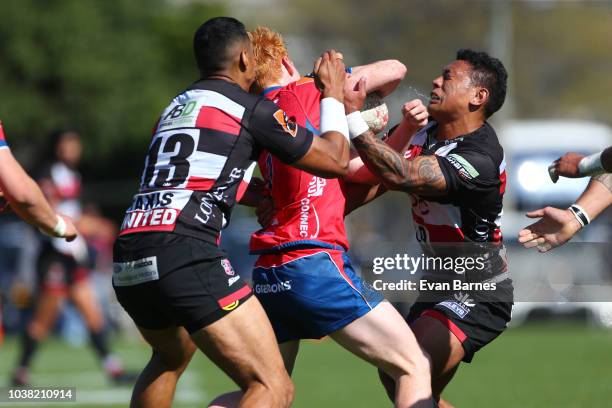 Finlay Christie tries to break the tackles of Nigel Ah Wong and Te Aihe Toma during the round six Mitre 10 Cup match between Tasman and Counties...