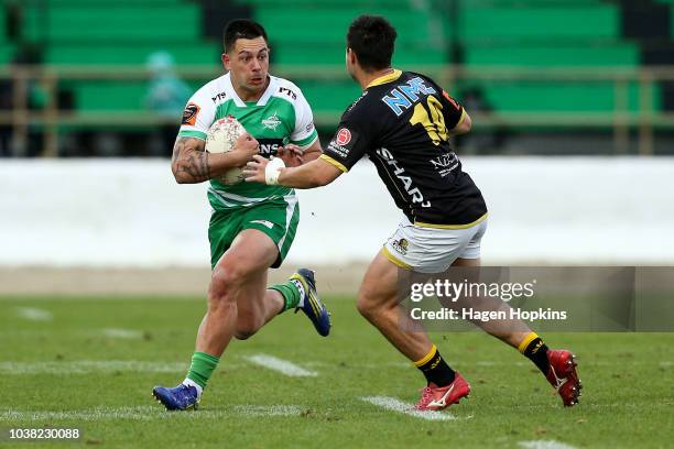 Rob Thompson of Manawatu runs at Jackson Garden-Bachop of Wellington during the round six Mitre 10 Cup match between Manawatu and Wellington at...