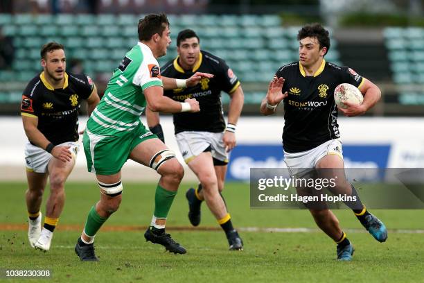 Thomas Umaga-Jensen of Wellington runs at Liam Mitchell of Manawatu during the round six Mitre 10 Cup match between Manawatu and Wellington at...